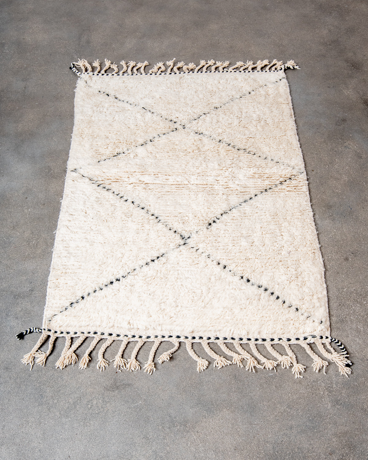 Modern, designer, handcrafted Berber rug from Morocco. Beniourain carpet with minimalist design, natural wool pile and a fluffy texture.